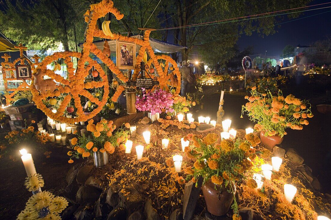 Flowers symbolizing the life of a passionate cyclist, Dia de Muertos (Day of the Dead) celebrations in a cemetery in Tzintzuntzan, Lago de Patzcuaro, Michoacan state, Mexico, North America