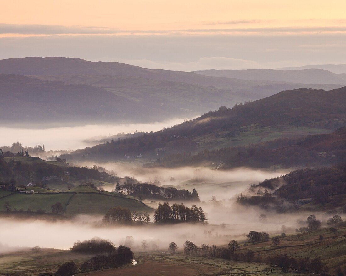 Mist lingers in the Little Langdale valley at dawn, Lake District National Park, Cumbria, England, United Kingdom, Europe