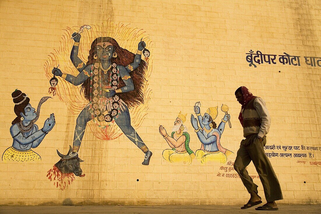 An Indian Man Walks By A Wall Painted Acheter L image 71045337 