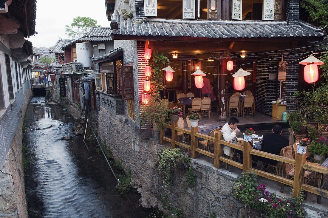 Traditional architecture of riverside restaurant in Lijiang Old Town, Lijiang, UNESCO World Heritage Site, Yunnan Province, China, Asia