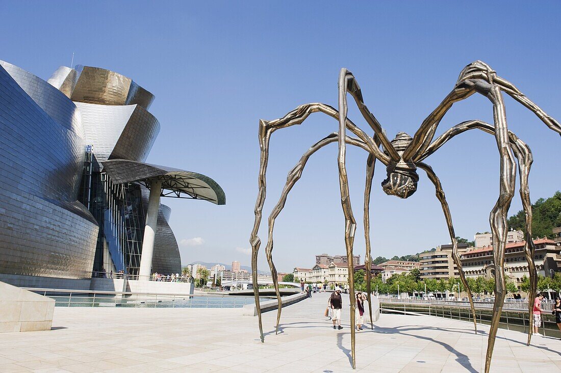 The Guggenheim, designed by architect Frank Gehry, and giant spider sculpture by Louise Bourgeois, Bilbao, Basque country, Spain, Europe