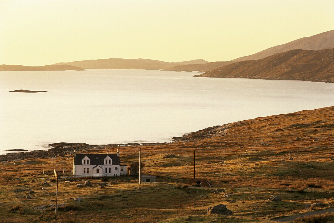 Sunset over Loch Tarbert and house, Isle of Harris, Outer Hebrides, Scotland, United Kingdom, Europe