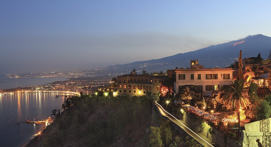 View from Taormina at dusk of coast and Mount Etna,  Sicily,  Italy,  Europe