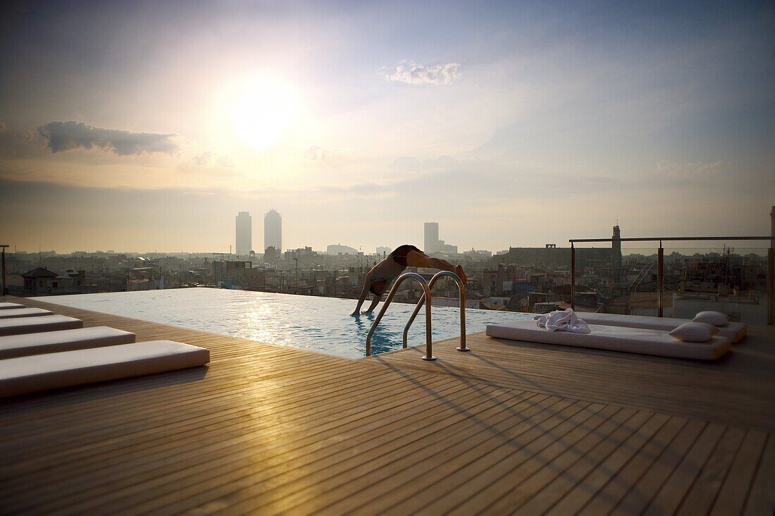 Man diving into rooftop pool,  Barcelona,  Catalonia,  Spain,  Europe