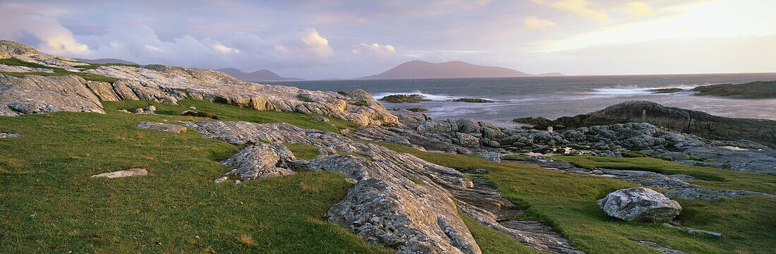 View towards the southern tip of the Isle of Harris from Taransay at dusk, Outer Hebrides, Scotland, United Kingdom, Europe