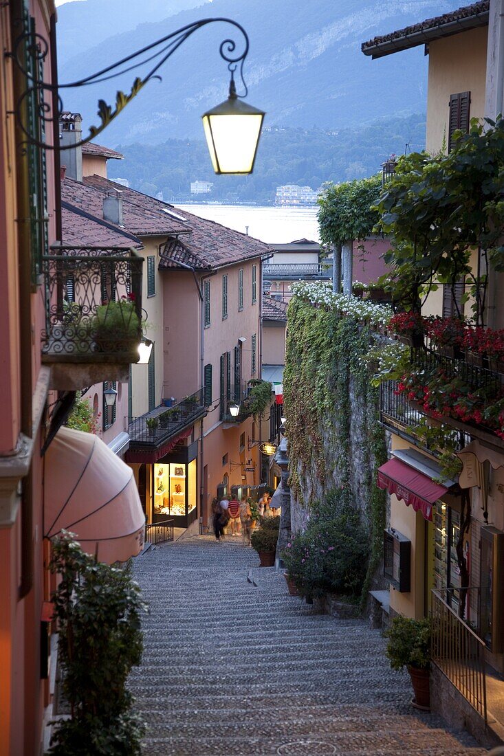 Shopping street at dusk, Bellagio, Lake Como, Lombardy, Italy, Europe