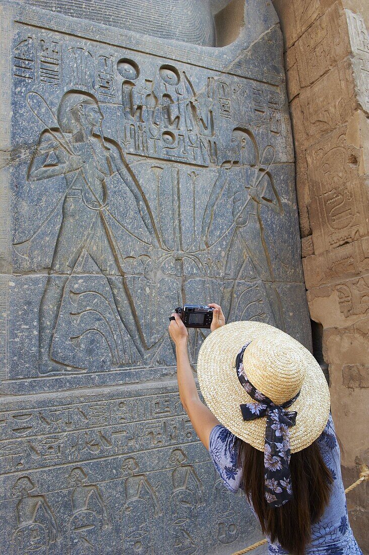 Tourist taking a photograph, Temple of Luxor, Thebes, UNESCO World Heritage Site, Egypt, North Africa, Africa