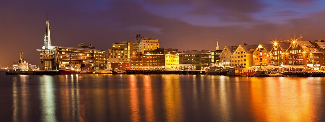 Arctic city of Tromso, harbour, port and waterfront warehouses, panorama at night, Tromso, Troms, North Norway, Scandinavia, Europe