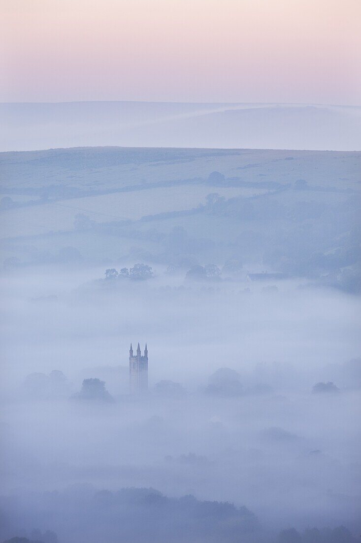 Widecombe-in-the-Moor Church surrounded by mist at dawn, Dartmoor National Park, Devon, England, United Kingdom, Europe