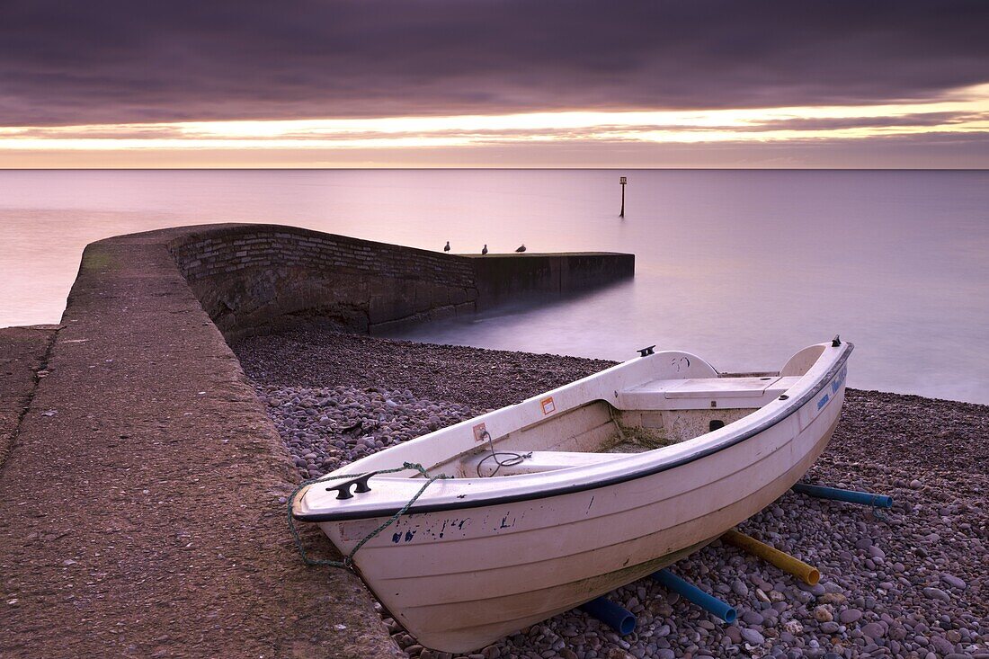 Fishing boat on Sidmouth beach at dawn, Sidmouth, Devon, England, United Kingdom, Europe