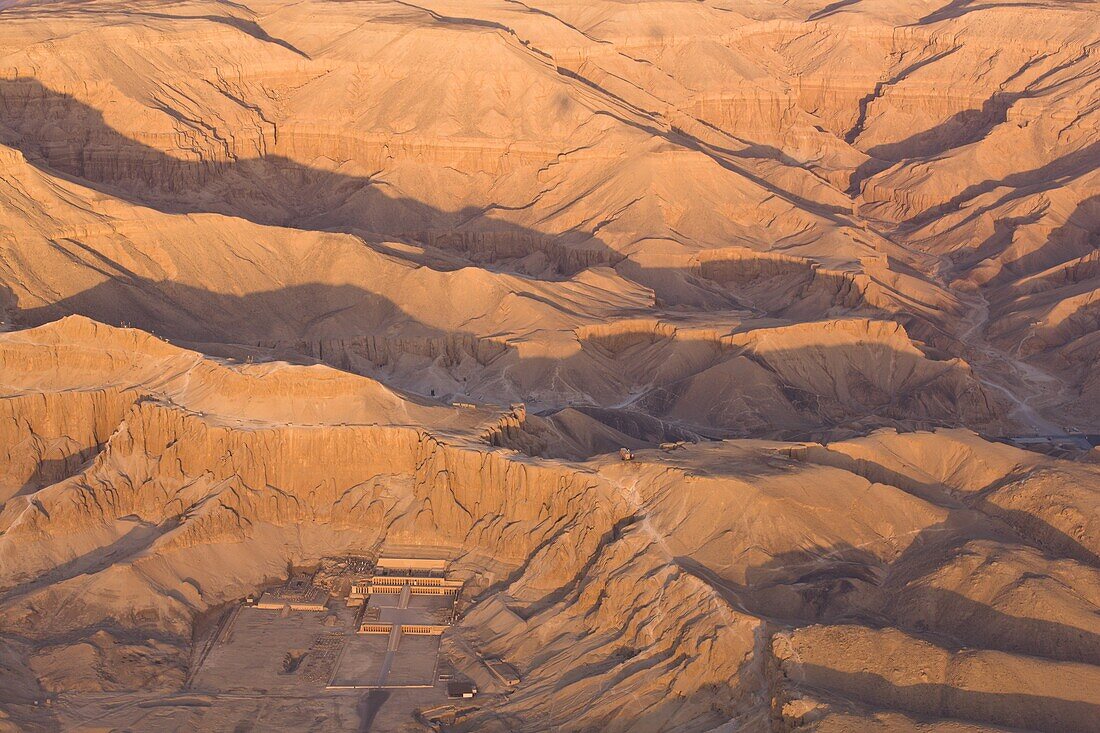 Aerial view from hot air balloon of Hatshepsut's Mortuary Temple at Deir el-Bahri, and the Valley of the Kings at sunrise, Thebes, UNESCO World Heritage Site, Egypt, North Africa, Africa