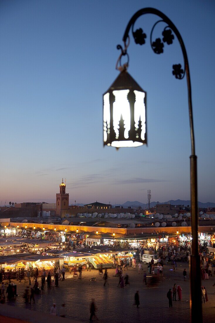 View over market square at dusk, Place Jemaa El Fna, Marrakesh, Morocco, North Africa, Africa