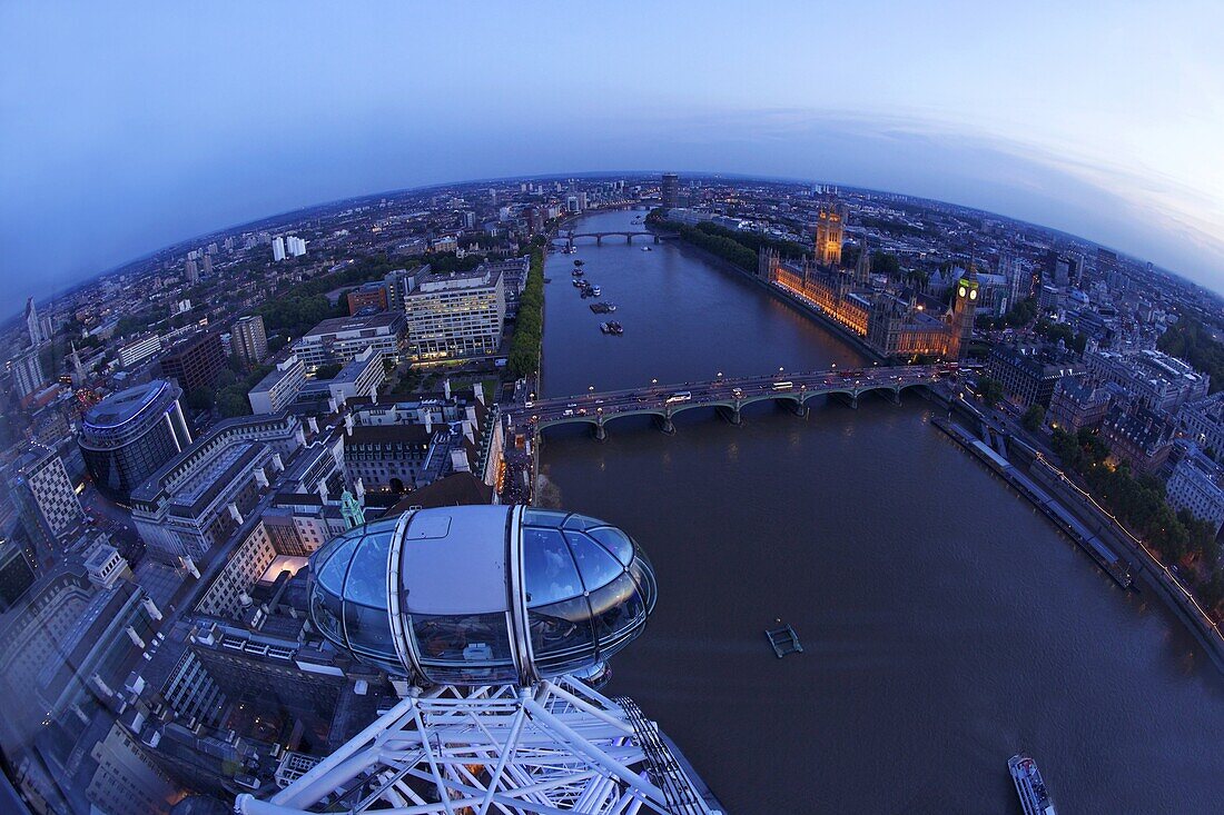View of passenger pod capsule, Houses of Parliament, Big Ben and the River Thames from the London Eye at dusk, London, England, United Kingdom, Europe