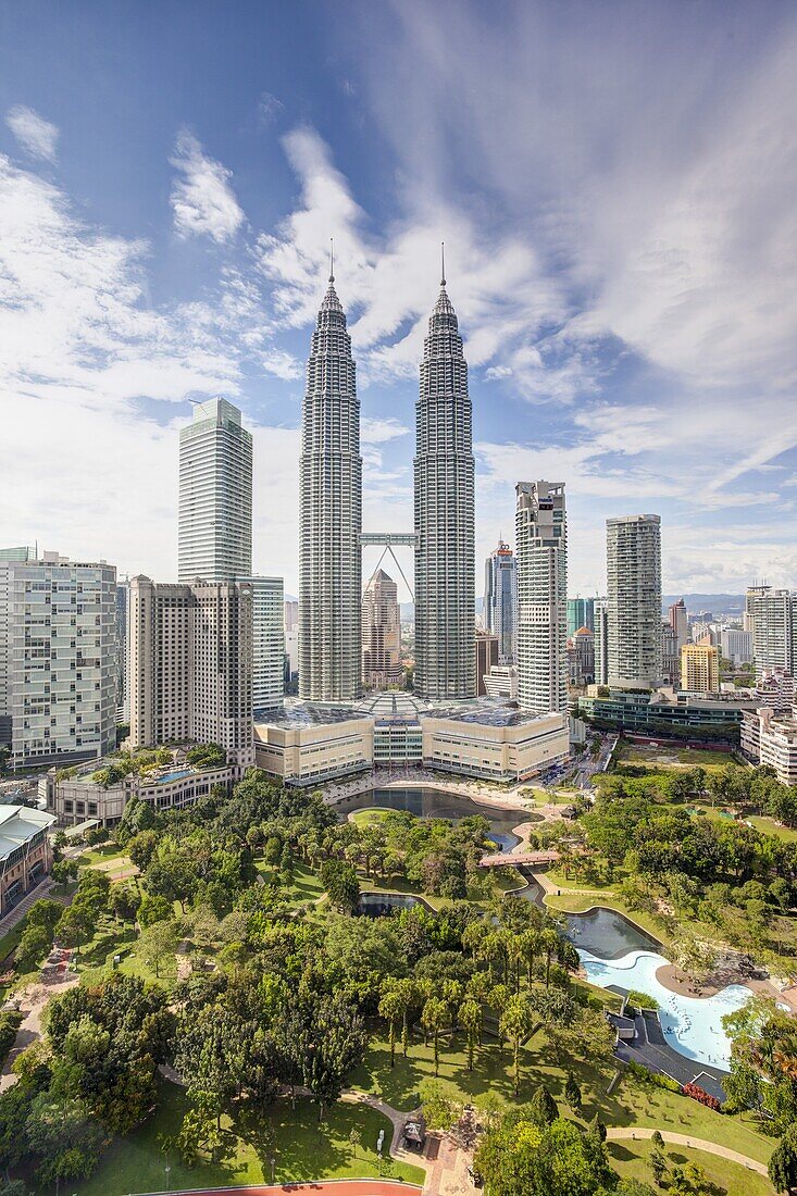 City centre including the KLCC park convention and shopping centre and the iconic 88 storey steel clad Petronas Towers, Kuala Lumpur, Malaysia, Southeast Asia, Asia