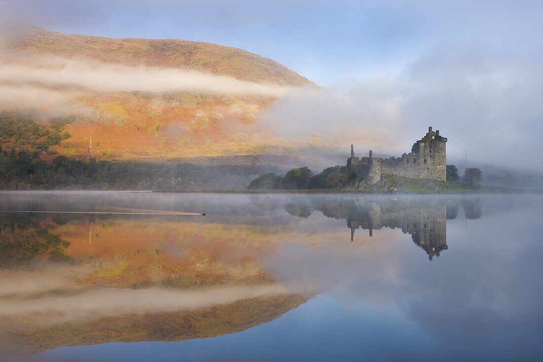 A misty autumn morning beside Loch Awe with views to Kilchurn Castle, Argyll and Bute, Scotland, United Kingdom, Europe