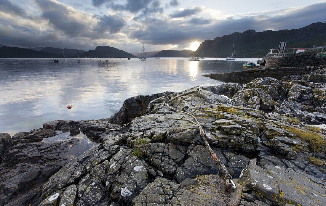 View over Loch Carron at dawn from rocks near the harbour, Plockton, Kintail, Highlands, Scotland, United Kingdom, Europe