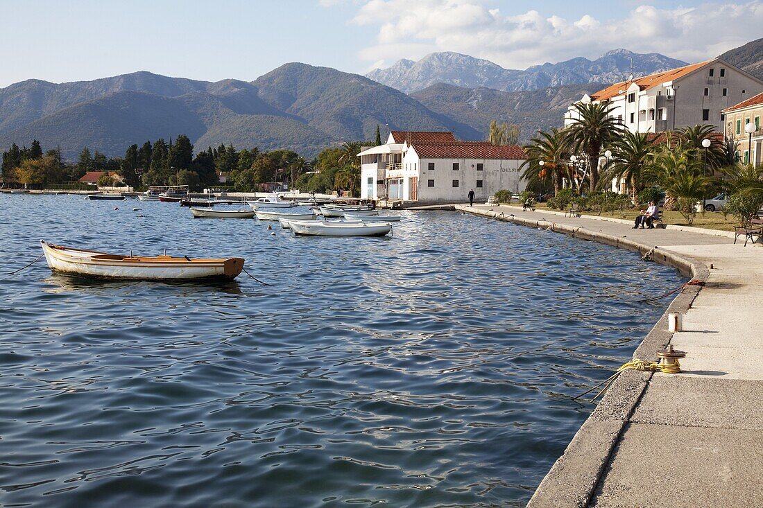 Waterfront near the newly developed Marina in Porto Montenegro with mountains behind, Montenegro, Europe