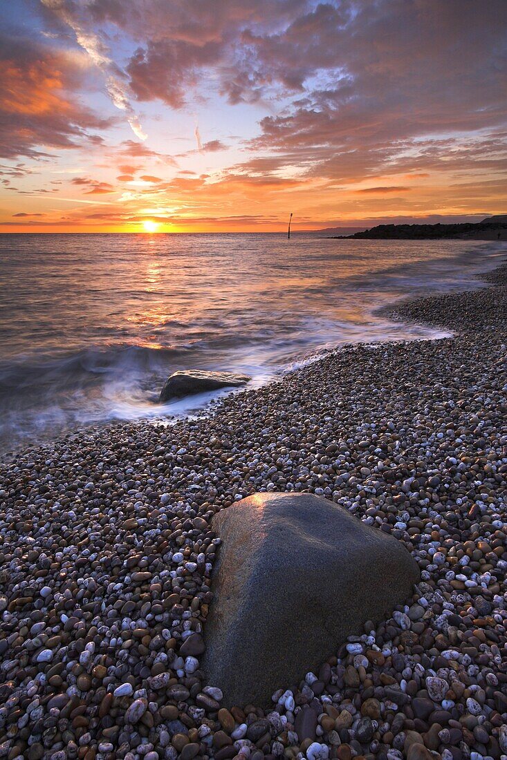 Sunset over the beach at West Bay on the Jurassic Coast, UNESCO World Heritage Site, Dorset, England, United Kingdom, Europe