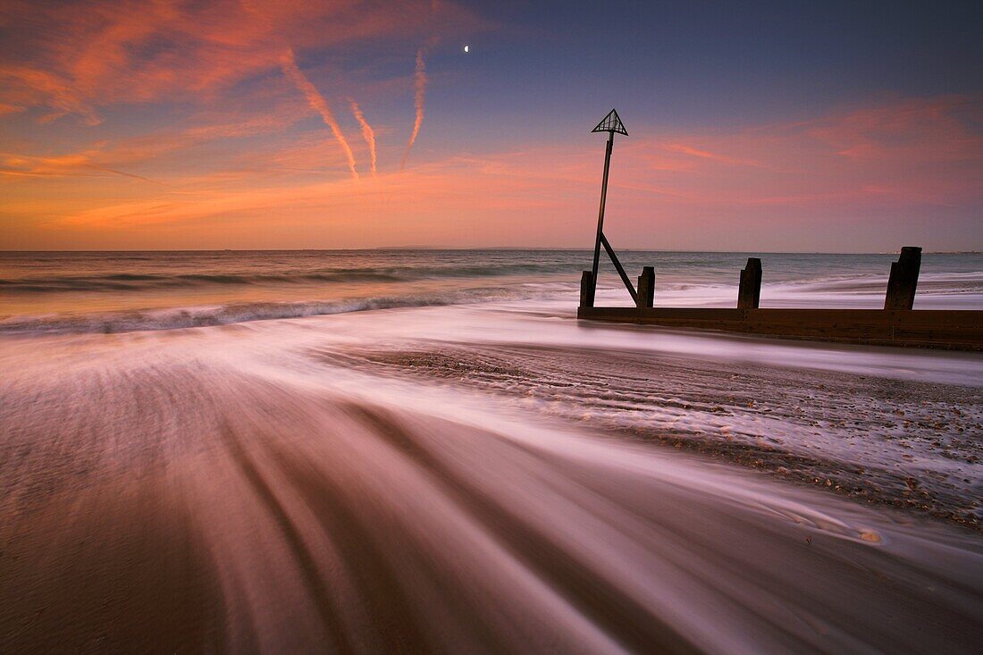 Surging tide at dawn on a Hayling Island beach, Hampshire, England, United Kingdom, Europe