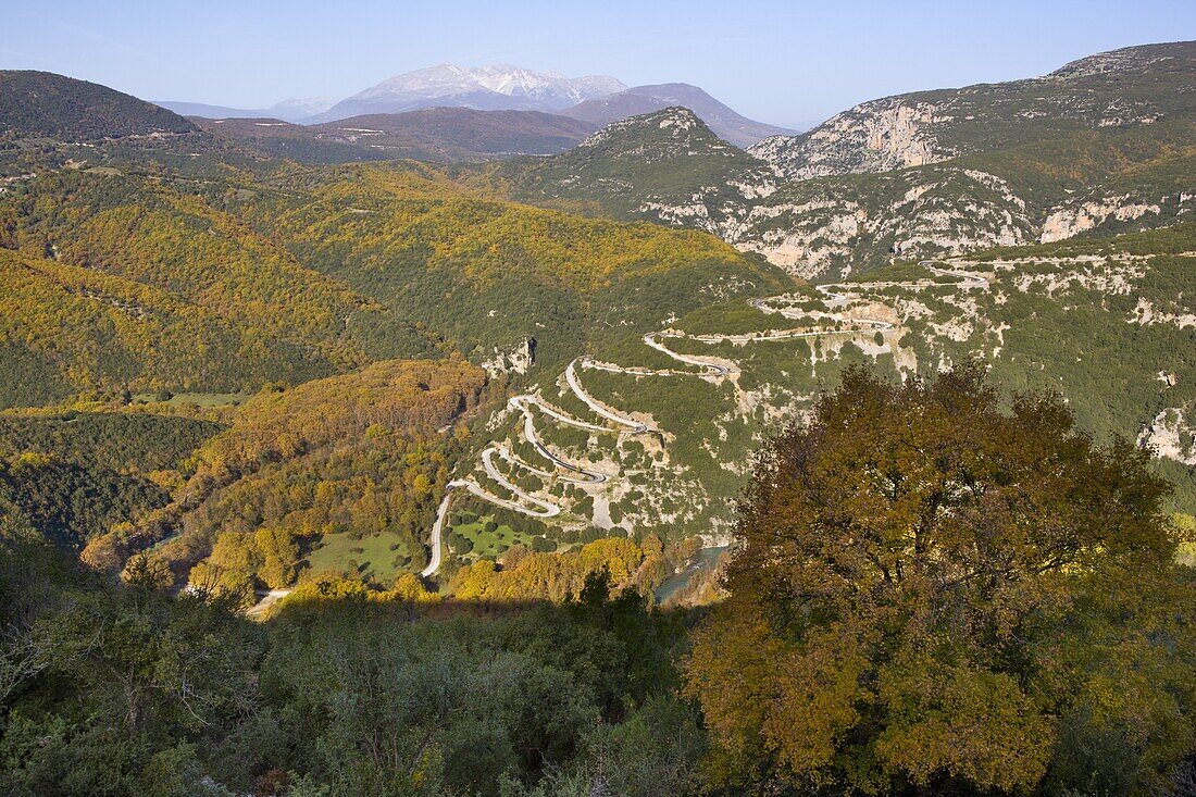 Looking down onto the hairpin bends as the road winds up the hill towards the Papingo (Papigo) villages in Zagoria, Epirus, Greece, Europe