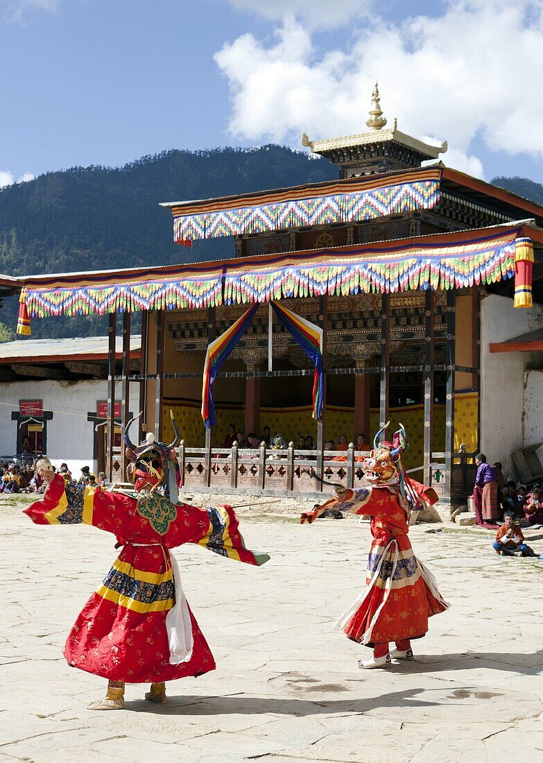 Buddhist monks performing masked dance during the Gangtey Tsechu at Gangte Goemba, Gangte, Phobjikha Valley, Bhutan, Asia