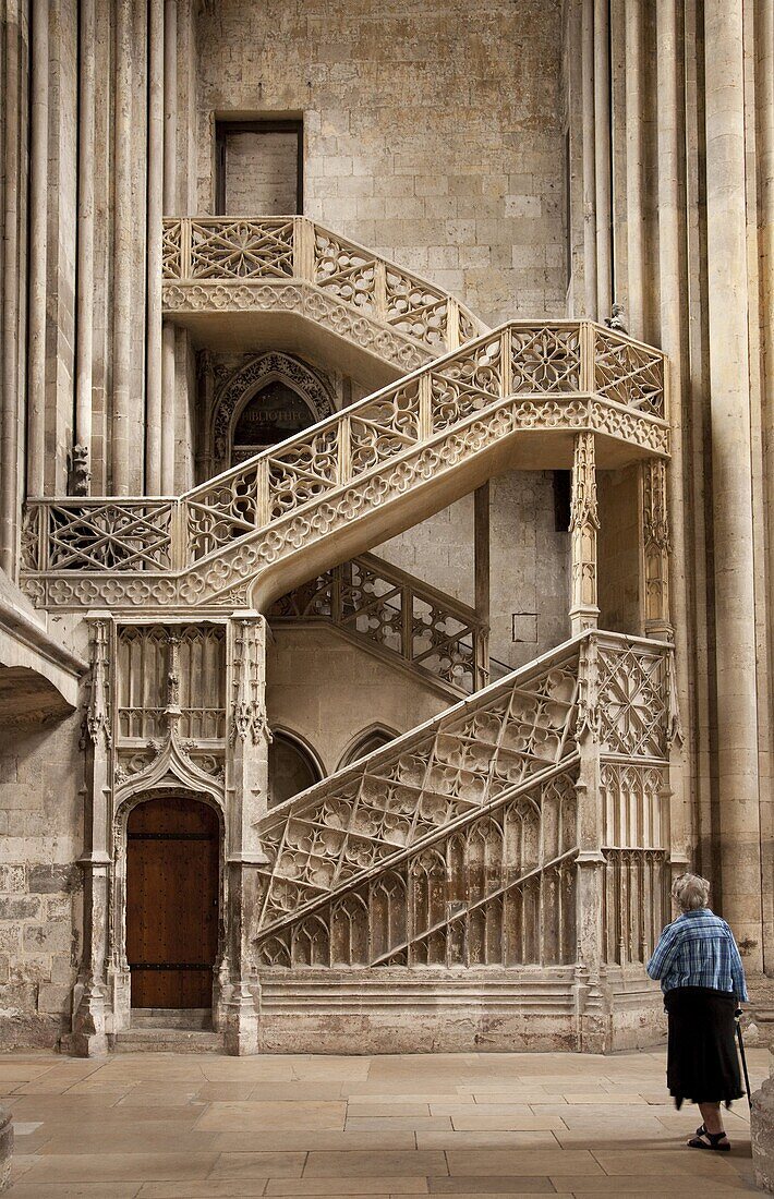 Lady with walking stick looking at Booksellers' Staircase, Rouen Cathedral, Rouen, Upper Normandy, France, Europe