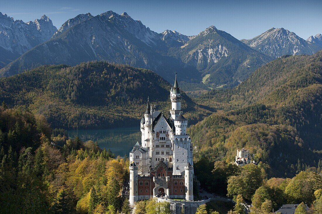 Romantic Neuschwanstein Castle and German Alps in autumn, southern part of Romantic Road, Bavaria, Germany, Europe