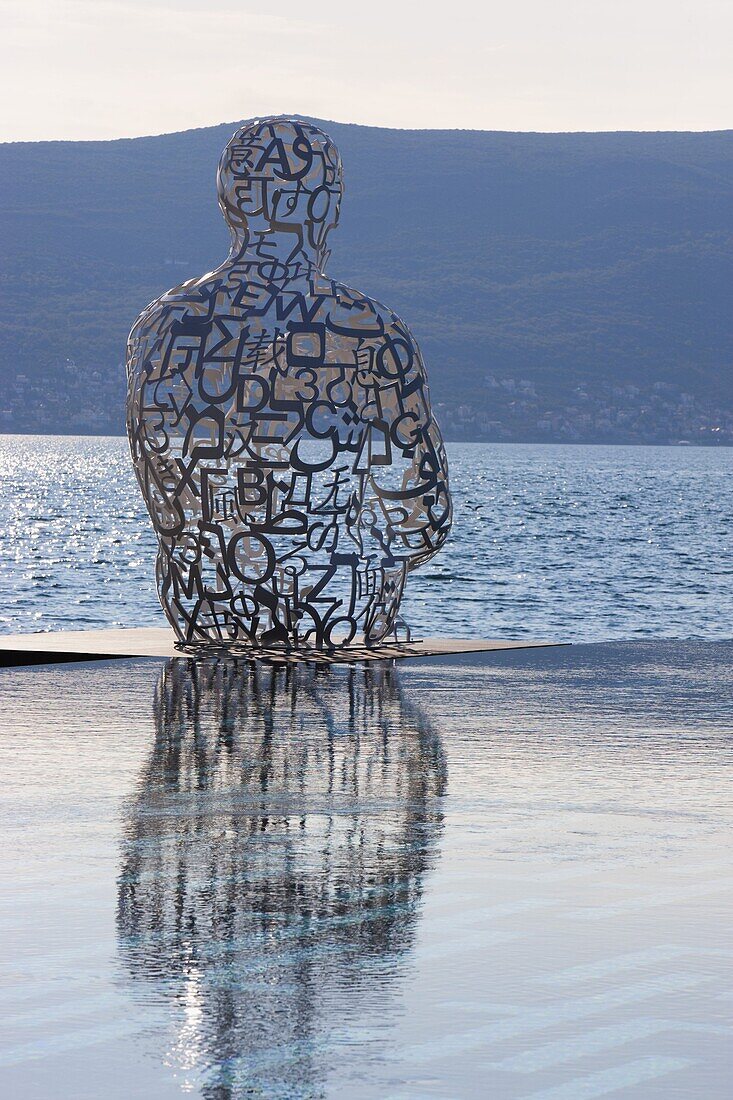 Sculpture of a man made of letters at the Lido Mar swimming pool at the newly developed Marina in Porto Montenegro, Montenegro, Europe