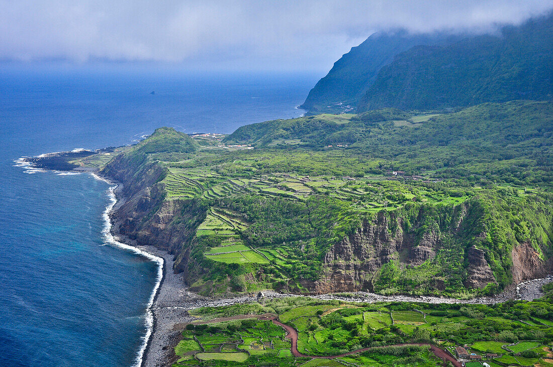 Steep coast with cliffs, terraces and mountains between Faja Grande and Fajazinha, Island of Flores, Azores, Portugal, Europe, Atlantic Ocean