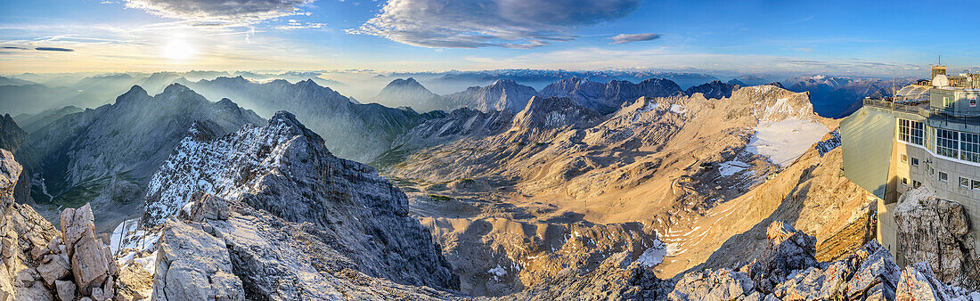 Panorama from summit of Zugspitze with Hoellental, Alpspitze, Jubilaeumsgrat, Wetterstein, Hohe Munde, Zugspitzplatt, Mieminger range and hut Muenchner Haus, Zugspitze, Wetterstein range, Upper Bavaria, Bavaria, Germany