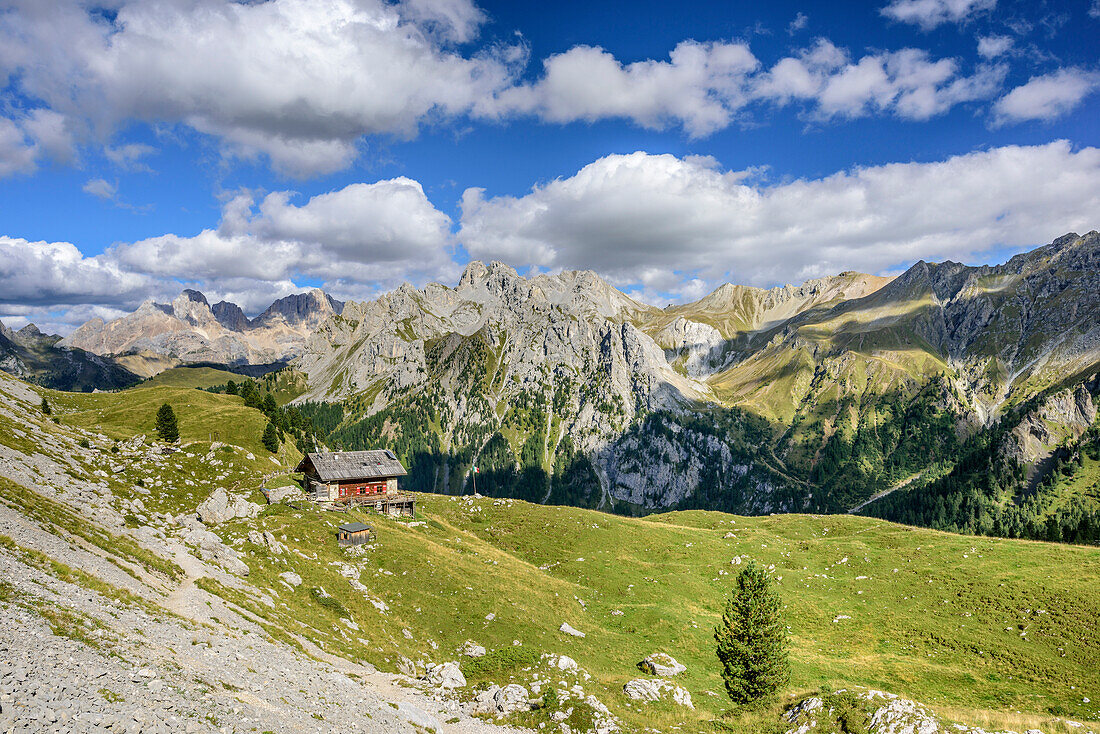 Hut Rifugio Vallaccia with Marmolada range in background, Vallaccia, Vallaccia range, Marmolada, Dolomites, UNESCO World Heritage Dolomites, Trentino, Italy