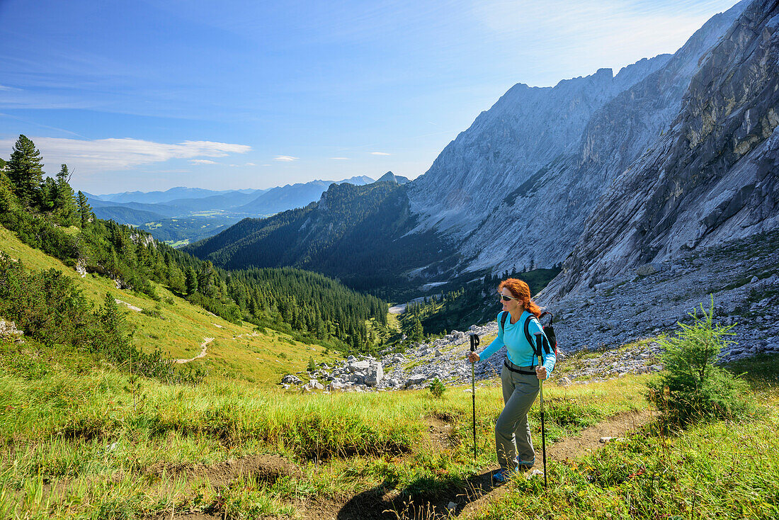 Woman hiking ascending towards Schachen, Schachen, Wetterstein range, Werdenfelser Land, Upper Bavaria, Bavaria, Germany