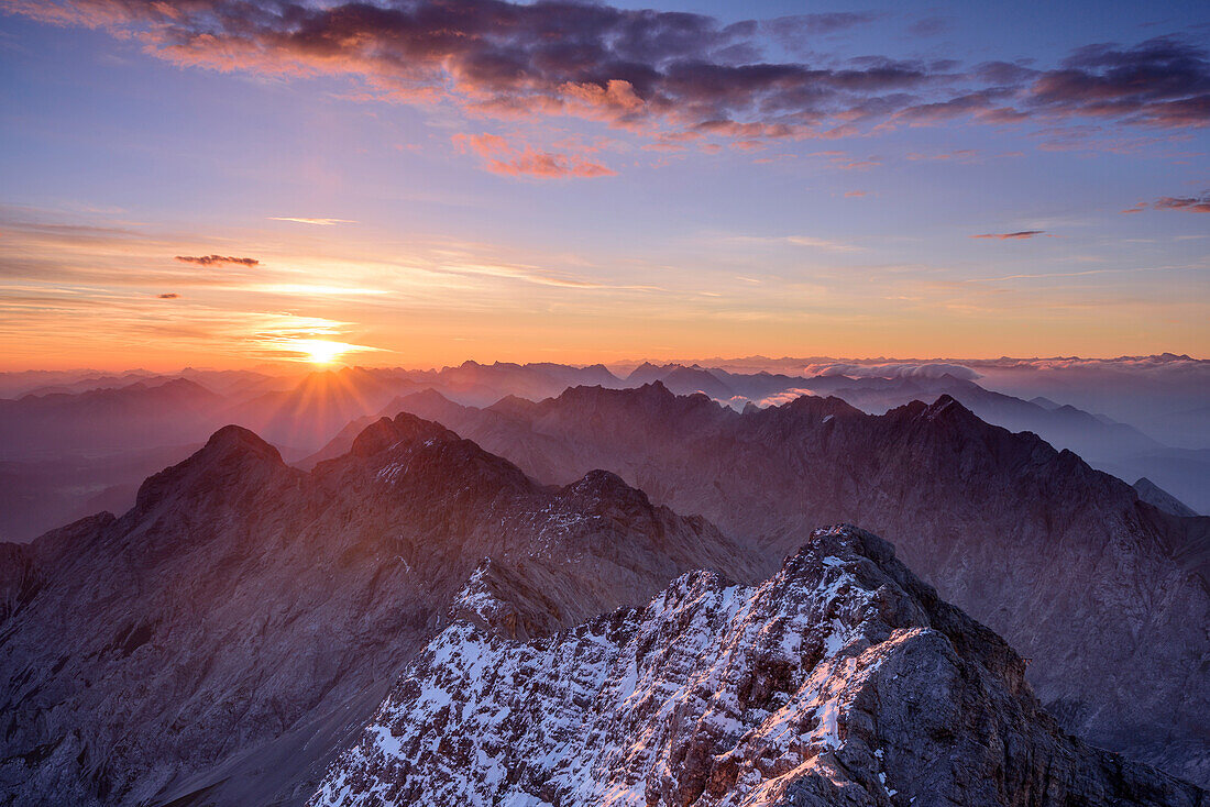 Sunrise above Alpspitze, Jubilaeumsgrat and Wetterstein range with Hochwanner, from Zugspitze, Wetterstein range, Upper Bavaria, Bavaria, Germany