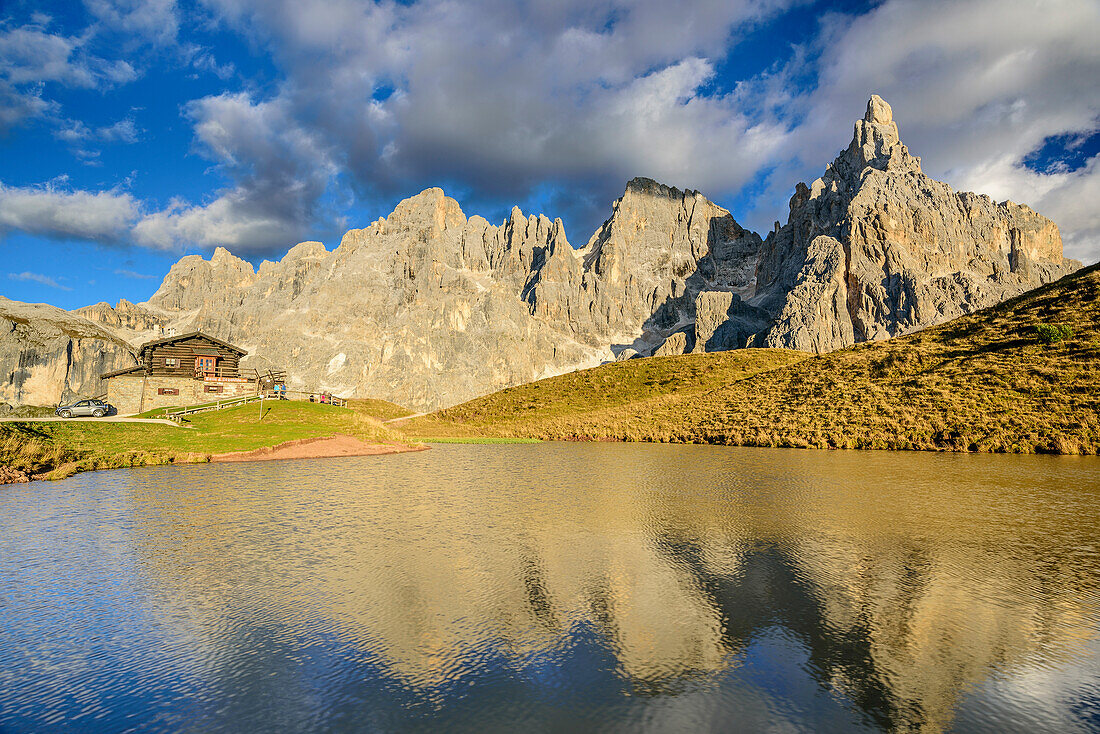 Baita Segantini with lake and Cima del Focobon, Cima di Val Grande, Cima dei Bureloni, Cima della Vezzana and Cimon della Pala, Pala range, Dolomites, UNESCO World Heritage Dolomites, Trentino, Italy