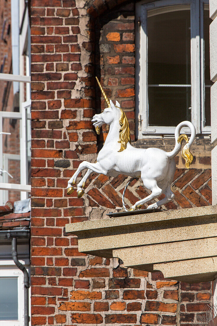Lueneburg, unicorn above pharmacy, clinker brick houses, Lower Saxony, Germany