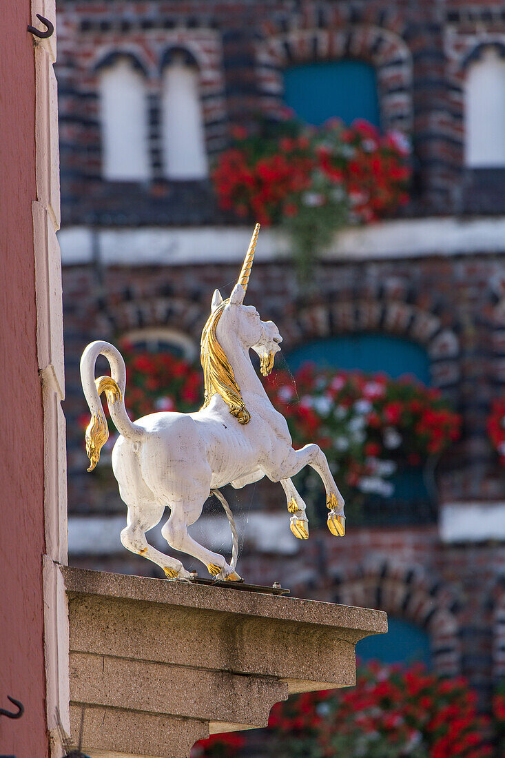 Lueneburg, unicorn above pharmacy, clinker brick houses, Lower Saxony, Germany