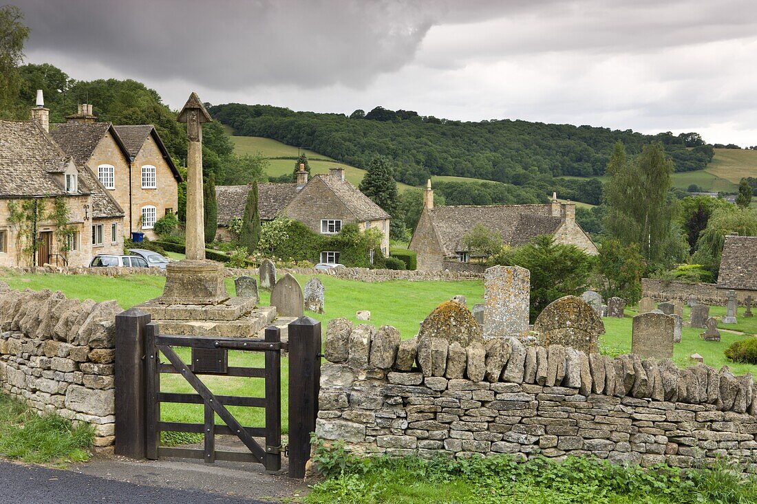 Graveyard and cottages in the pretty Cotswolds village of Snowshill, Worcestershire, England, United Kingdom, Europe