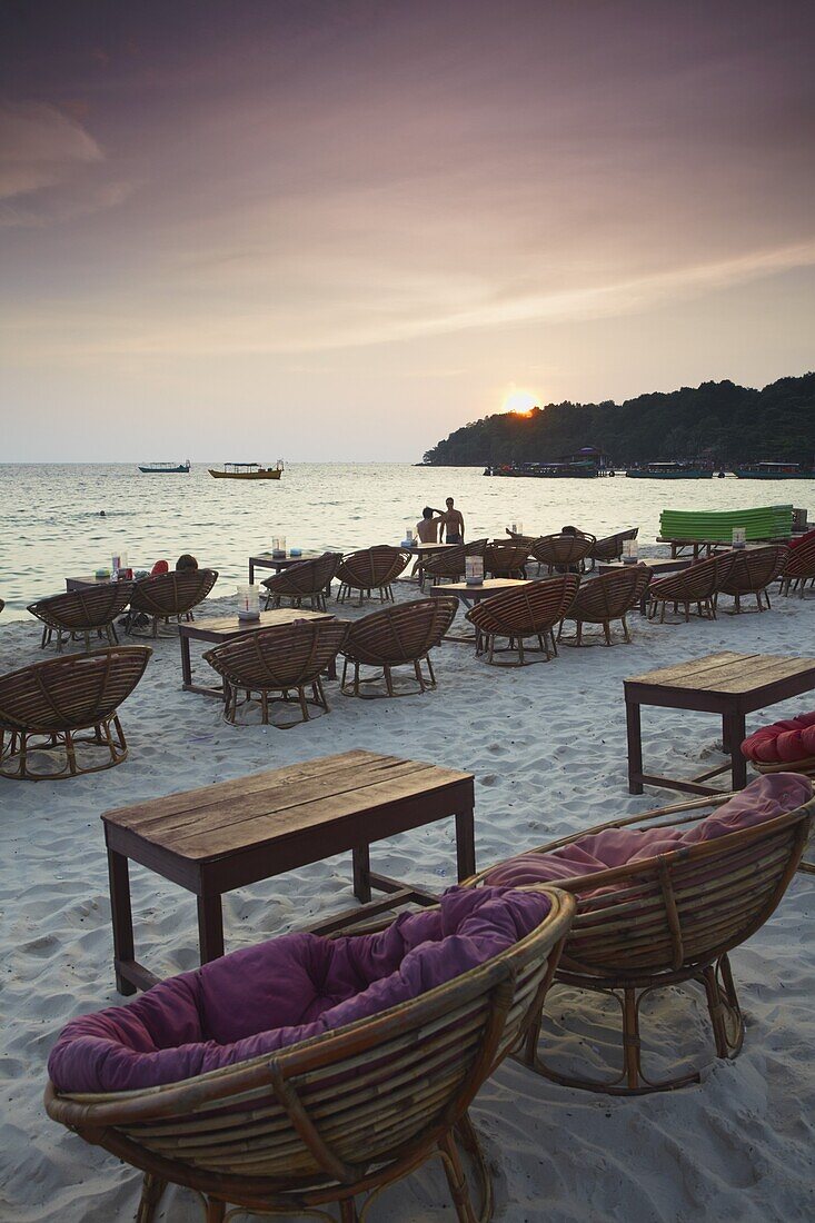 Beach restaurants at dusk on Ochheuteal Beach, Sihanoukville, Cambodia, Indochina, Southeast Asia, Asia