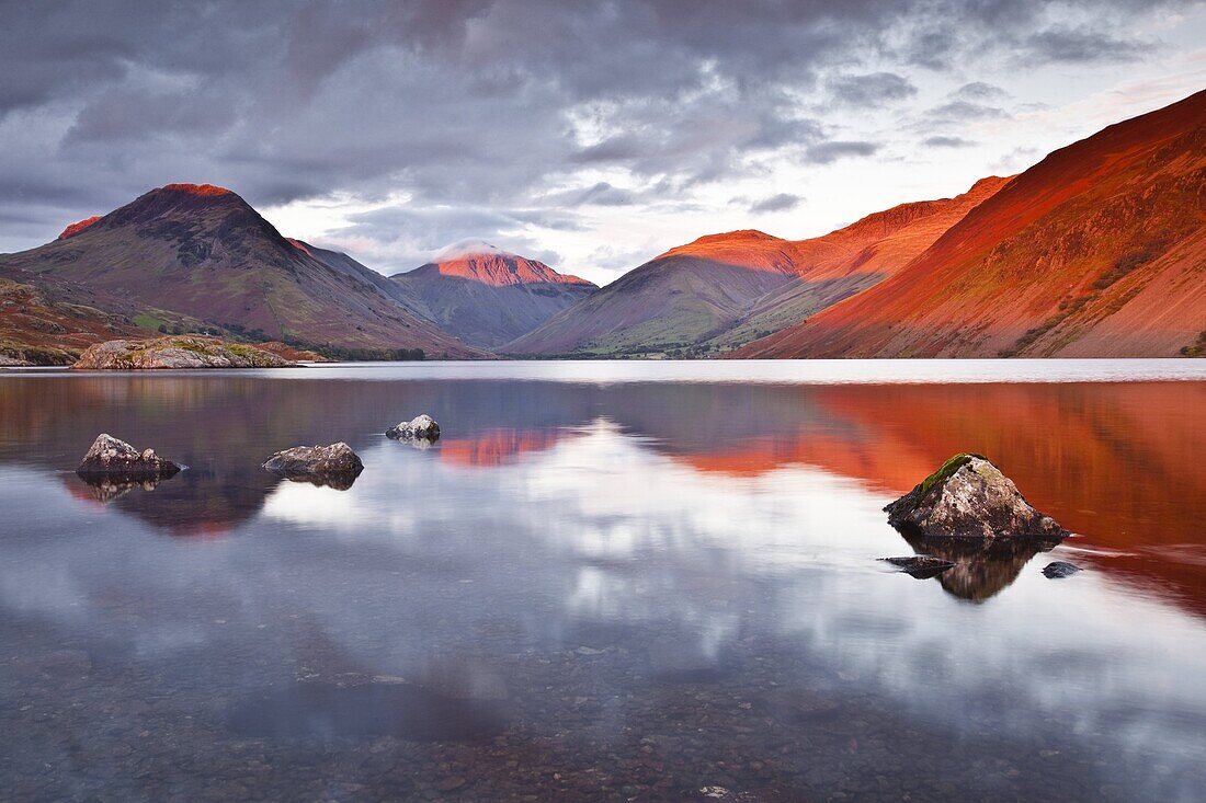 The Scafell range across the reflective waters of Wast Water in the Lake District National Park, Cumbria, England, United Kingdom, Europe