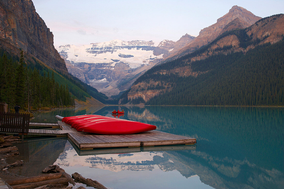 Victoria Glacier and canoes on Lake Louise, Sunrise, Banff National Park, Rocky Mountains, Alberta, Canada