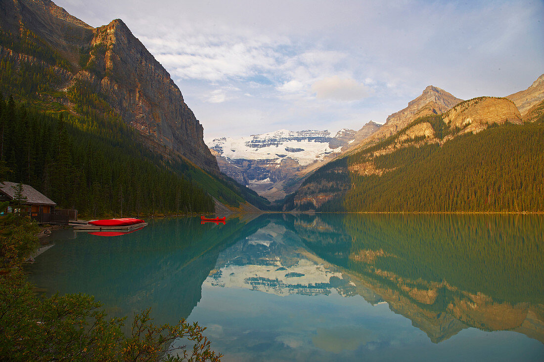 Victoria Glacier and canoes on Lake Louise, Banff National Park, Rocky Mountains, Alberta, Canada