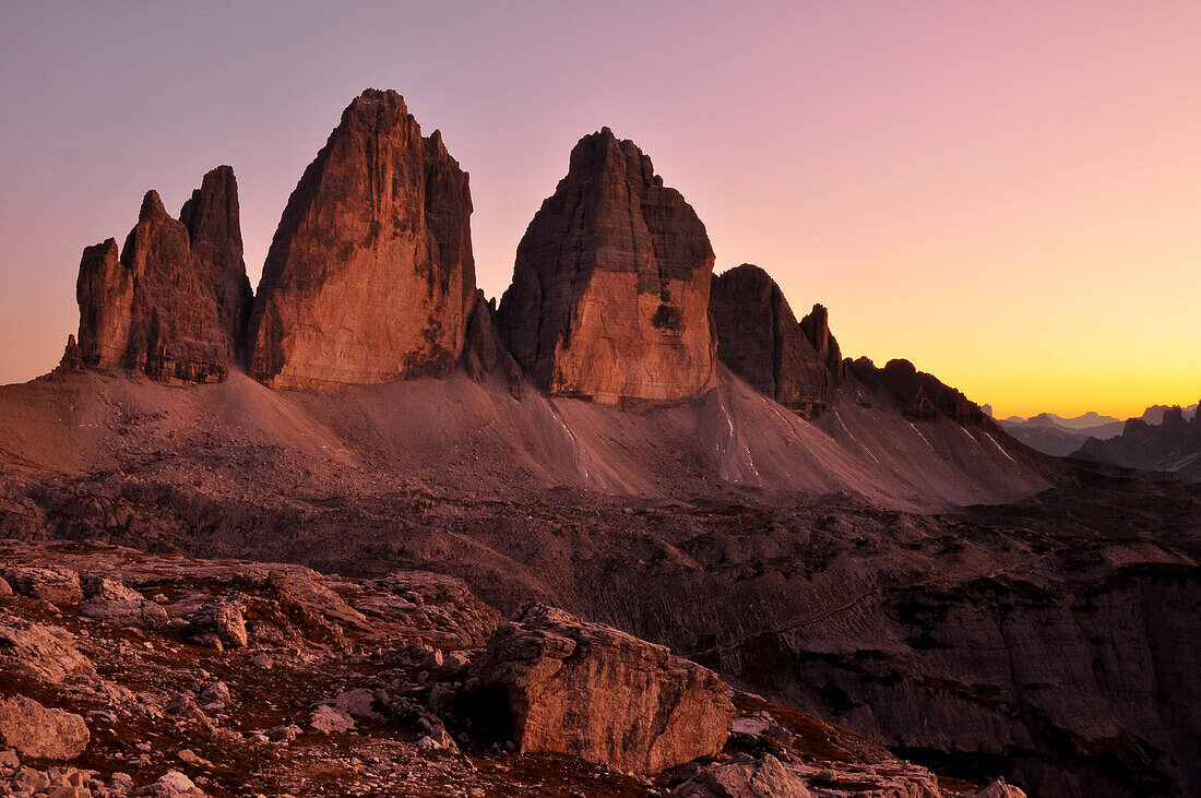 Sunset over Three Peaks (Drei Zinnen) and mountain ranges, Val Pusteria Valley, Sesto, Dolomites, South Tyrol, Veneto, Alto Adige, Three Peaks (Tre Cime di Lavaredo) Nature Park, UNESCO world heritage side, Italy, European Alps, Europe