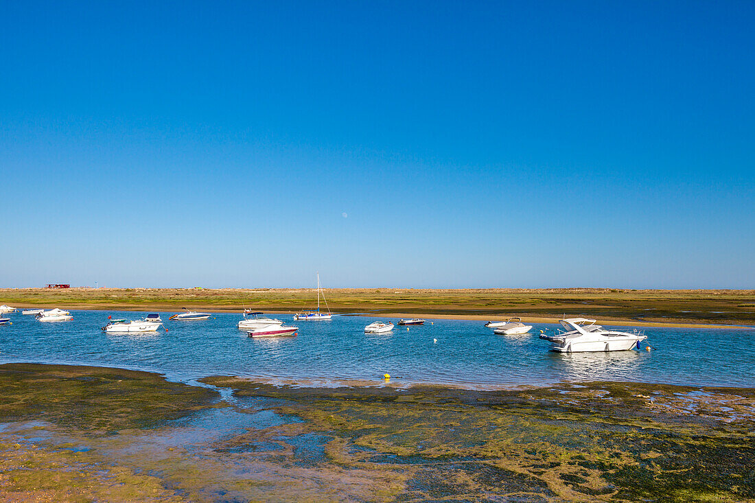 Boats in the lagoon, Cabanas near Tavira, Algarve, Portugal