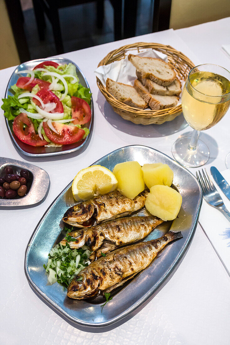 Grilled sardines in a restaurant, Algarve, Portugal