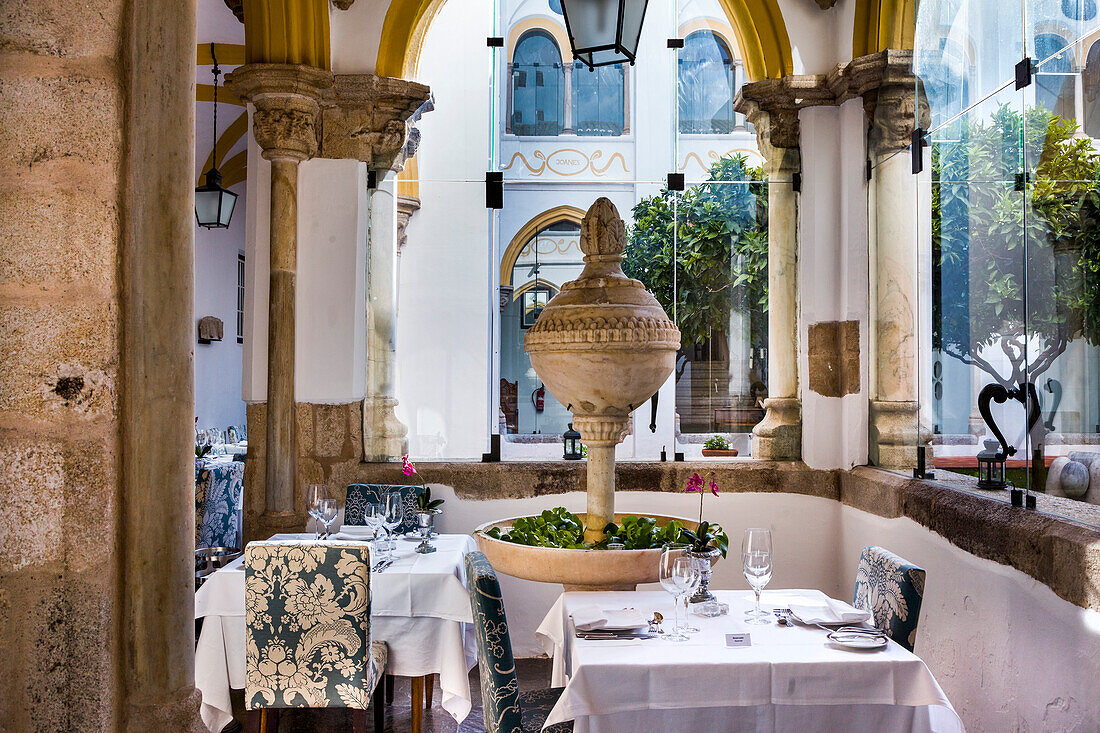 Restaurant in cloister, Pousada dos Loios, a former monastery, Evora, Alentejo, Portugal