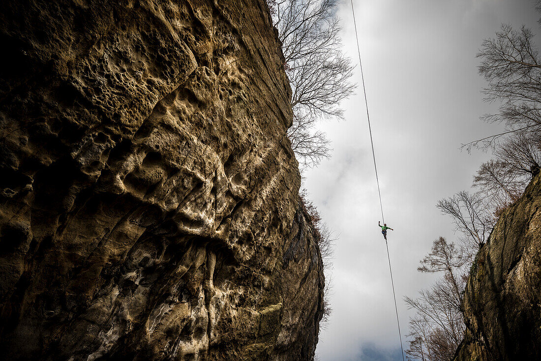 German Slackliner Julian Mittermaier walks across a 113m long and 30m high Highline in Neubeuren, Bavaria, Germany.