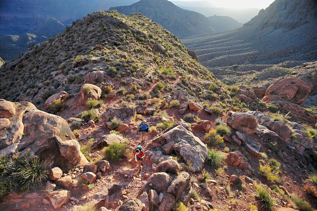 Hikers climb out of Surprise Valley through a break in the 400-foot-tall Redwall on the Thunder River Trail in the Grand Canyon outside of Fredonia, Arizona November 2011.  Part of a 21.4-mile loop that connects the Thunder River and Deer Creek Trails.  T