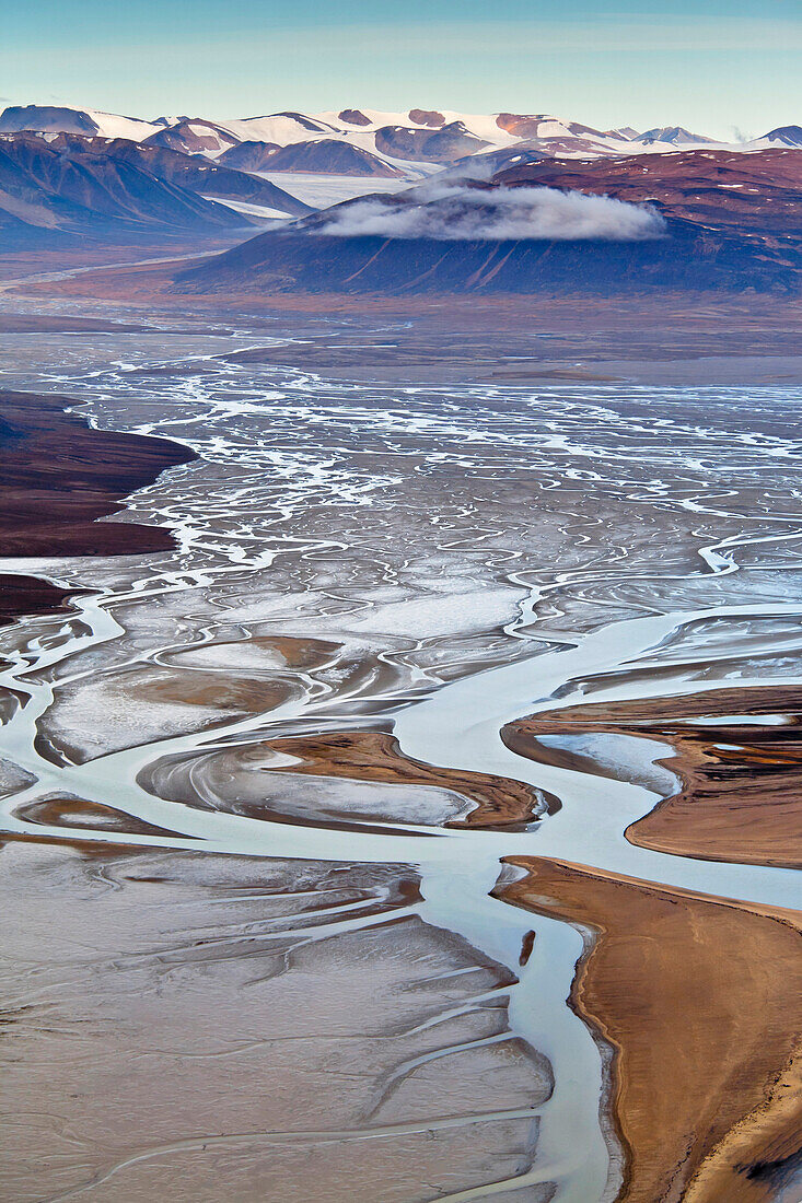 A slow flowing stream becomes braided as it nears the ocean in Bathurst Bay, Bylot Island, Sirmilik National Park, Nunavut, Canada on August 30, 2010.