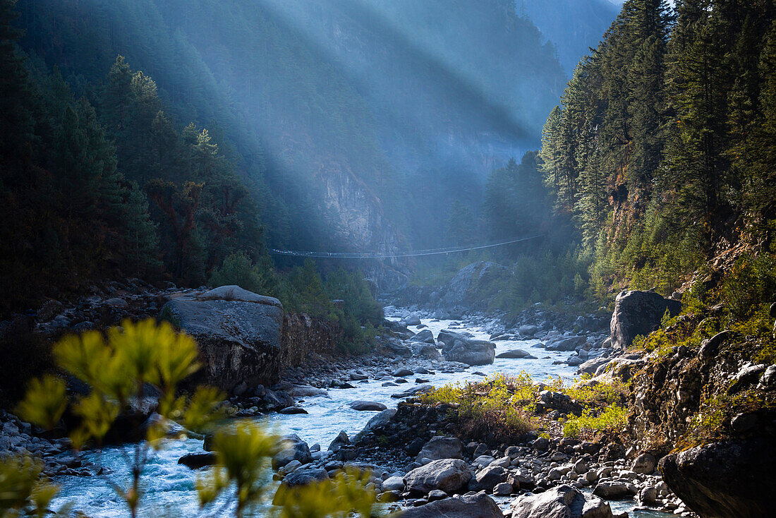 A footbridge crossing the Dudh Kosi (river) below Namche Bazaar in Sagarmatha National Park, Nepal.