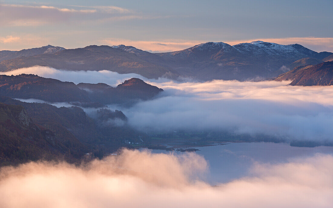 Early morning mist hangs above Derwent Water in autumn, Lake District National Park, Cumbria, England, United Kingdom, Europe